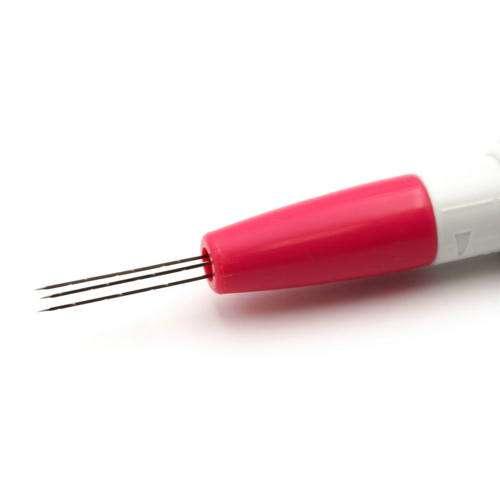 White and pink felting needle tool on a white background